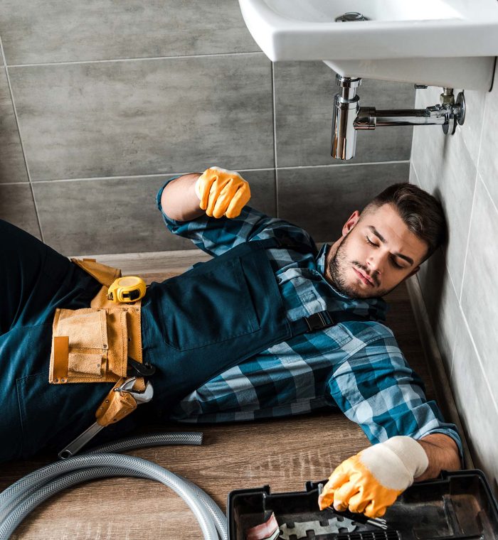 bearded-handyman-lying-on-floor-near-toolbox-in-ba-resize.jpg