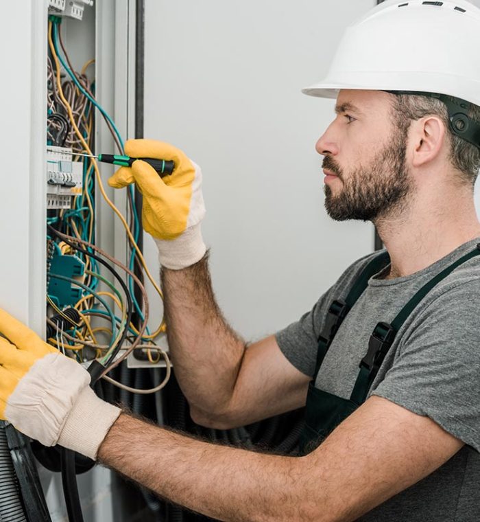 side-view-of-handsome-bearded-electrician-repairin-resize.jpg